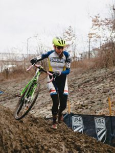 Shields walking her bike along the course