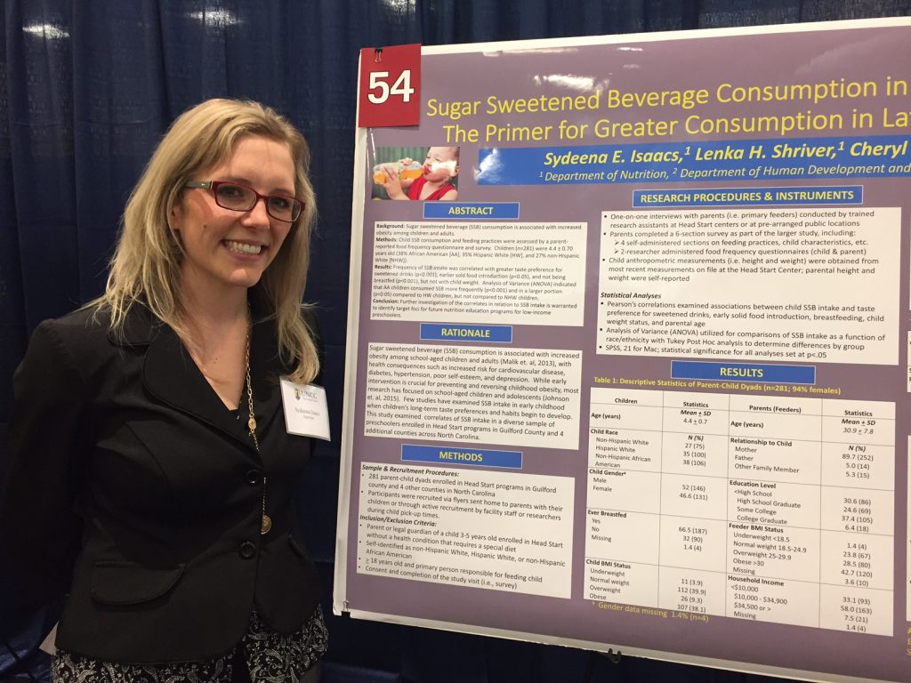 Sydeena Isaacs stands by her poster during the 2017 Graduate Research and Creativity Expo